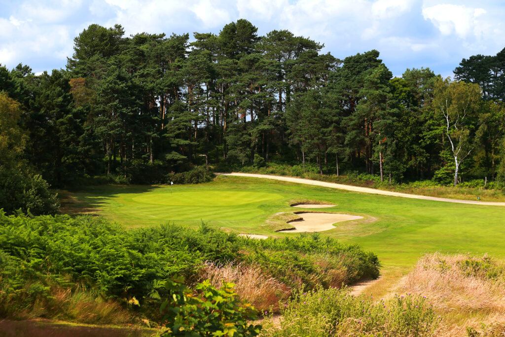 Hole with bunkers and trees around at Broadstone Golf Club