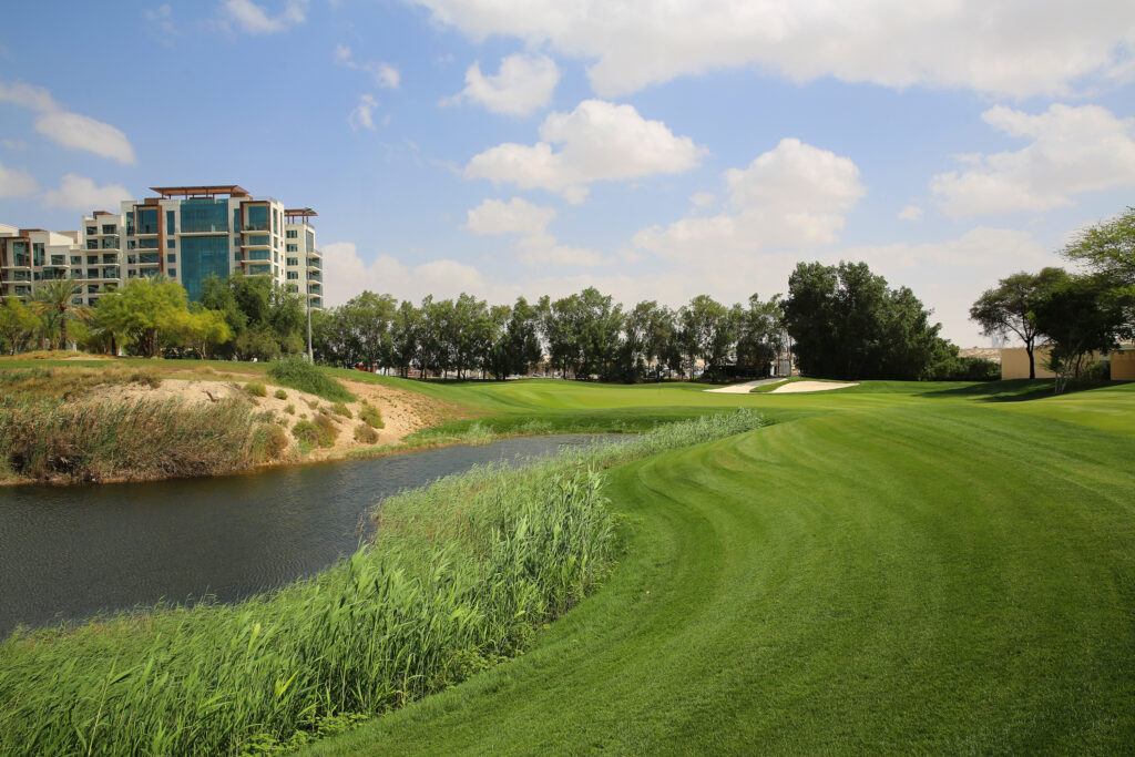 Lake on fairway at Emirates Golf Club - The Faldo with trees in background