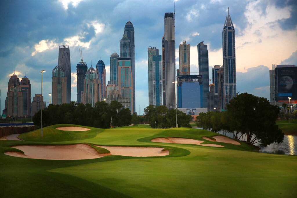 Bunkers on fairway with buildings in distance at Emirates Golf Club - The Faldo