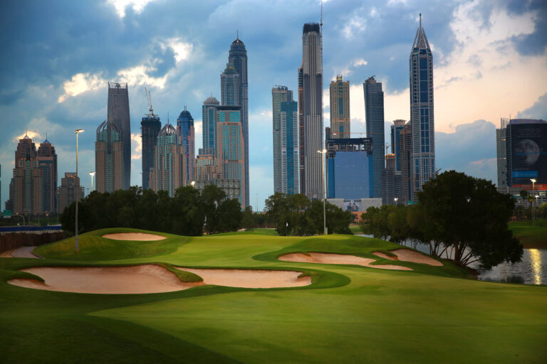 Bunkers on fairway with buildings in distance at Emirates Golf Club - The Faldo