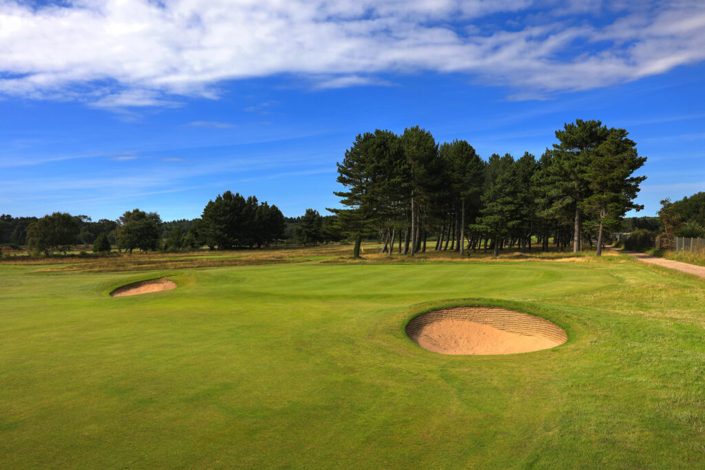 Hole with bunkers and trees in background at Formby Golf Club