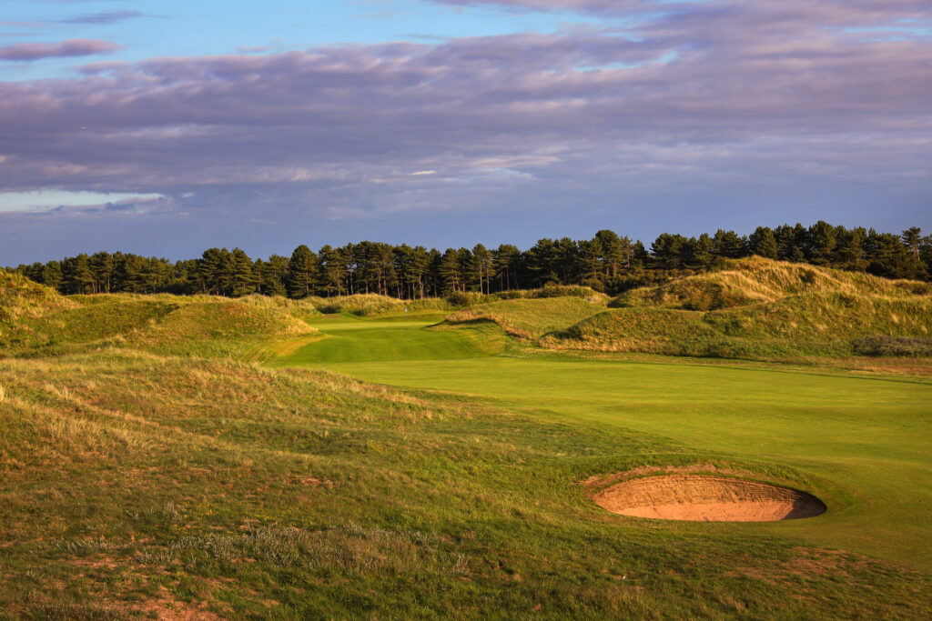 Fairway with trees in background at Formby Golf Club