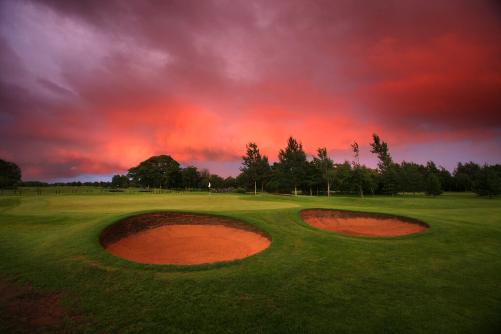 Hole with bunkers and trees in background at Formby Hall - Championship Old Course