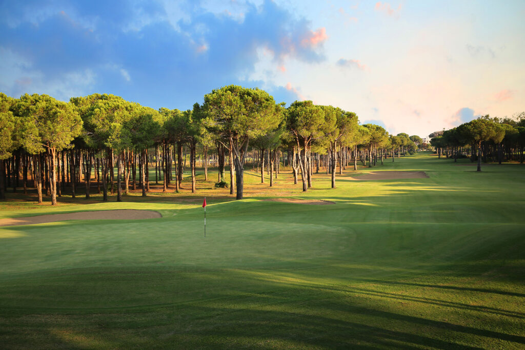 Hole with bunkers and trees in background at Gloria - Old Golf Course