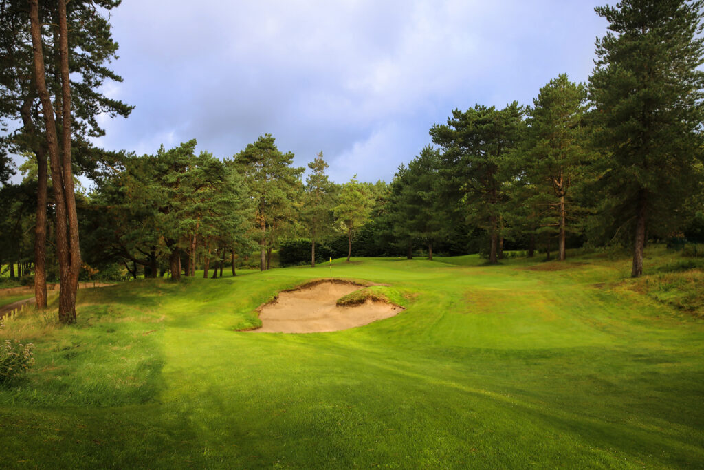 Bunker on fairway at Hardelot - Les Dunes Course with trees around