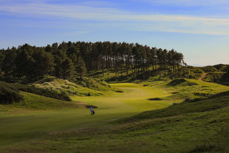 Fairway with trees in distance at Hillside Golf Club