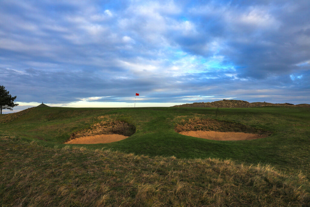 Hole with red flag and bunkers at Hunstanton Golf Club