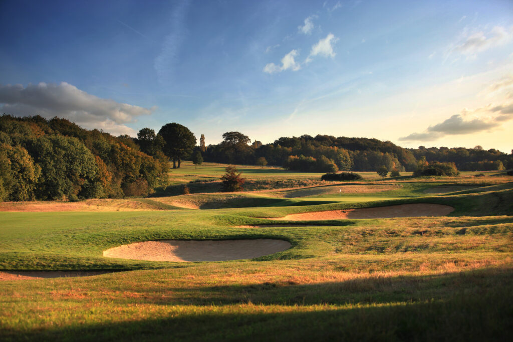 Bunkers on fairway with trees around at The London Golf Club