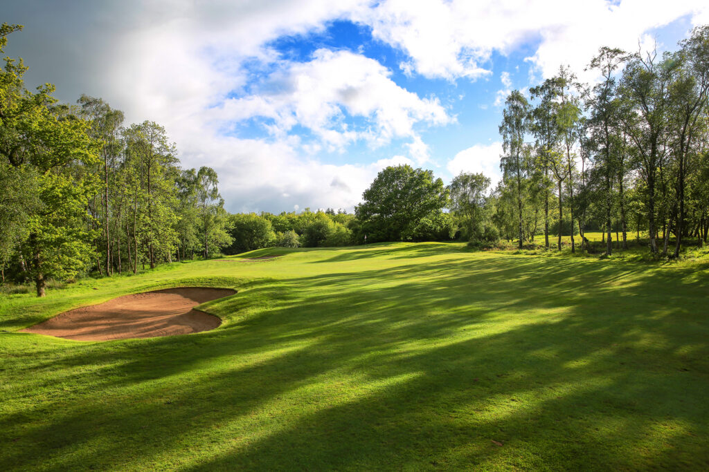 Fairway with bunker with trees around at Macdonald Linden Hall Golf Course