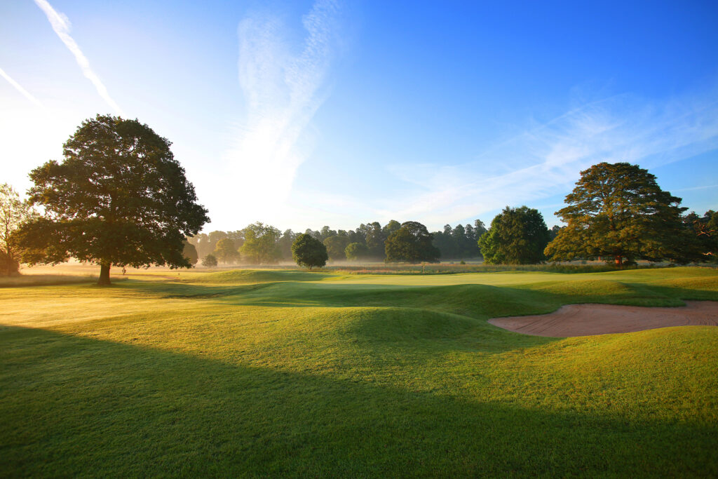 Fairway with bunker and trees around at Mottram Hall Golf Course