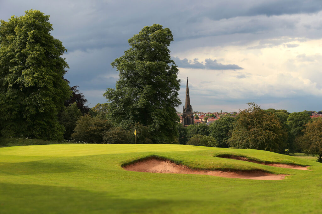 Hole with bunkers at Oulton Hall Golf Club with trees around