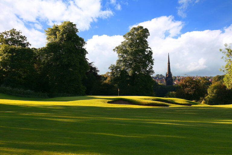 Hole with bunkers with trees around at Oulton Hall Golf Club