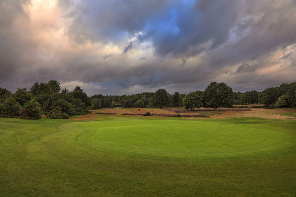 Hole with red flag at Piltdown Golf Club