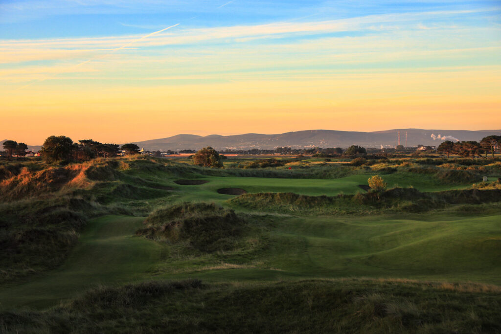 Hole with bunkers at Portmarnock Golf Club with mounds around