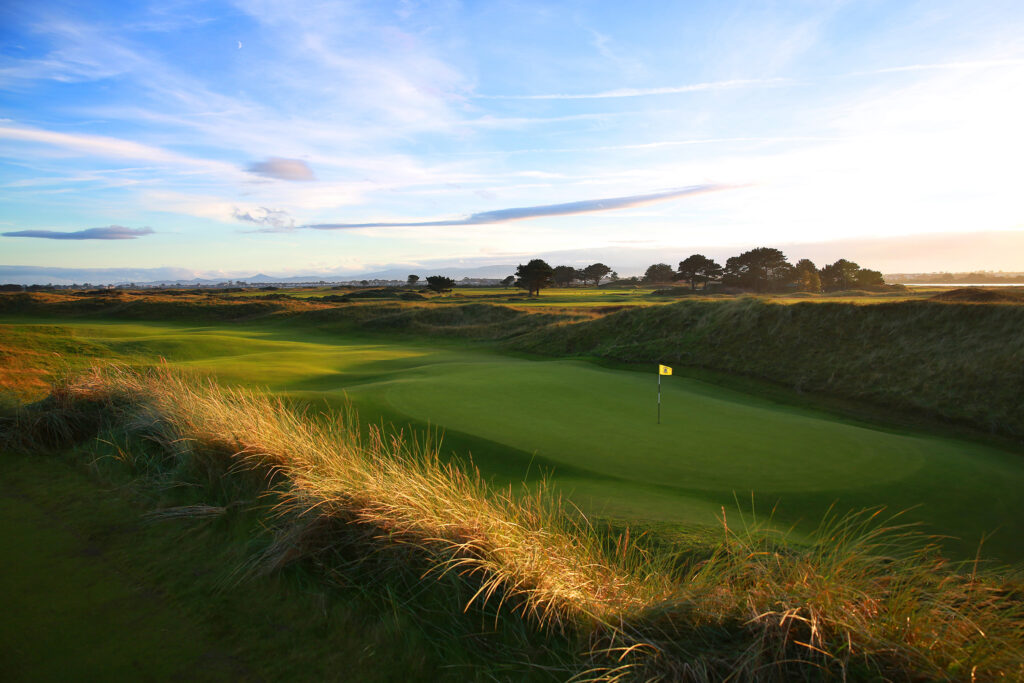 Hole with yellow flag at Portmarnock Golf Club