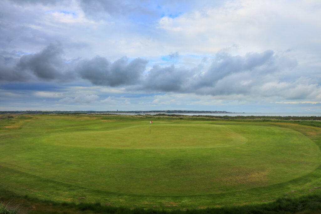 Hole with red and white flag at Prince's Golf Club