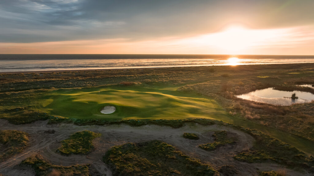 Aerial view of Prince's Golf Club with ocean in background