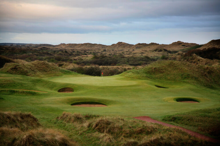 Hole with red flag and bunkers at Royal Birkdale