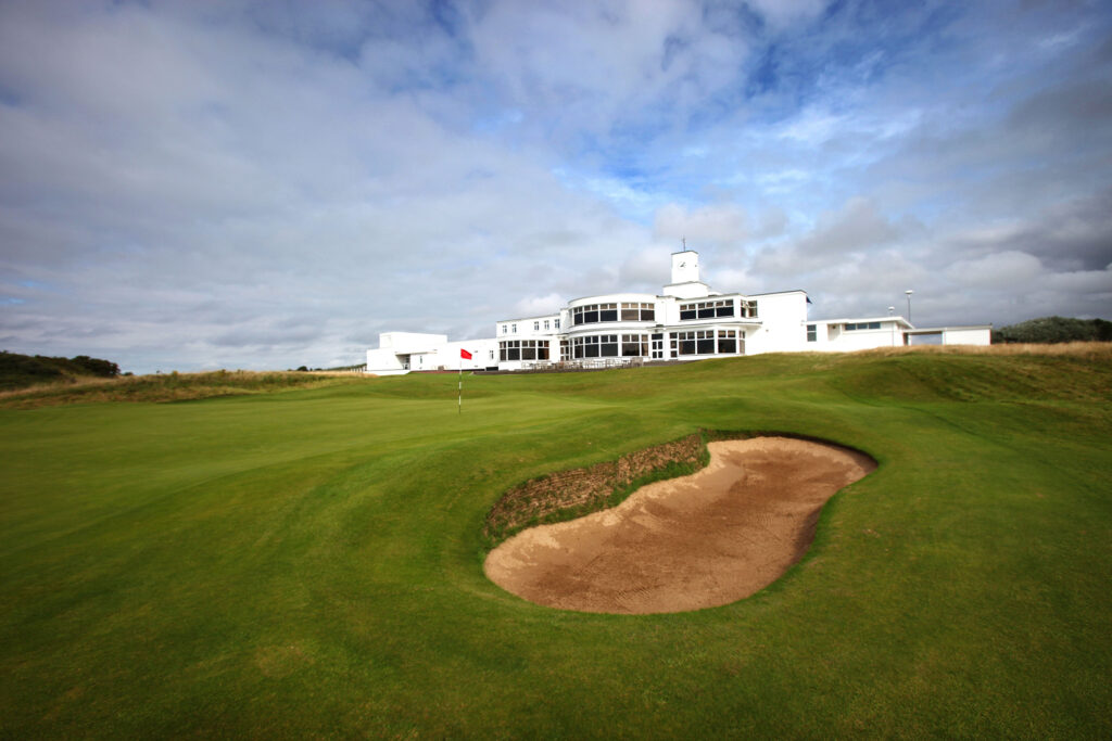 Hole with bunker at Royal Birkdale with building in background