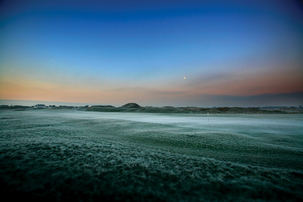 Fairway at Royal St George's Golf Club with hole with white flag