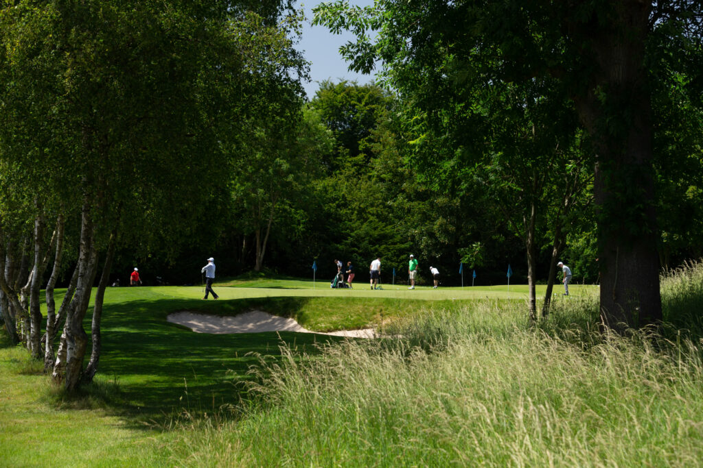 People using the practice facilities at The Grove - Championship