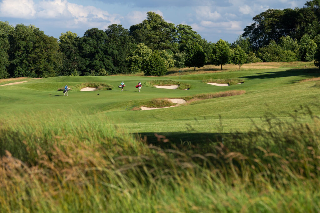 People playing golf at The Grove - Championship