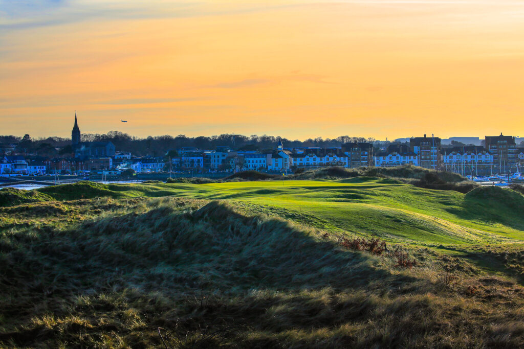 Hole with fairway and buildings in distance at The Island Golf Club