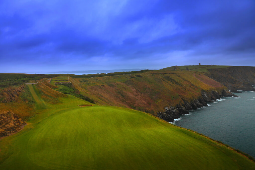 Hole on cliffside at Old Head Links with ocean view