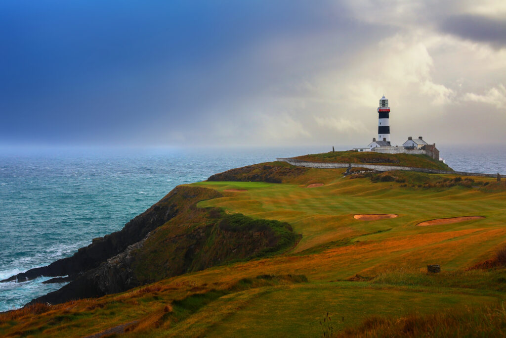 Fairway with bunkers at Old Head Links with lighthouse in distance