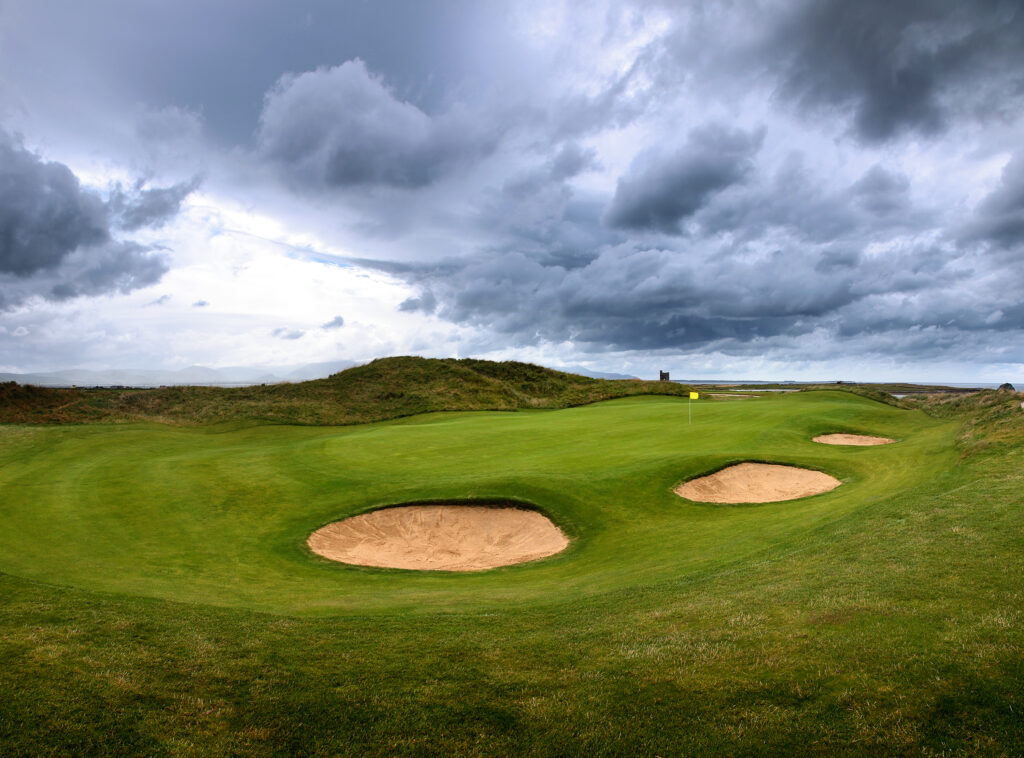 Hole with bunkers and yellow flag at Tralee Golf Club