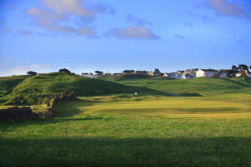 Hole with houses in background at Championship Course at Trevose Golf & Country Club