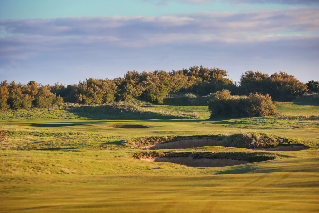 Fairway with bunkers and shrubbery in background at Championship Course at Trevose Golf & Country Club