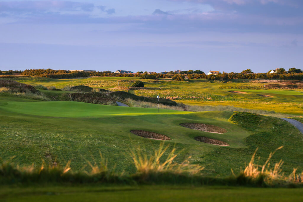 Hole with white flag and bunkers at Championship Course at Trevose Golf & Country Club