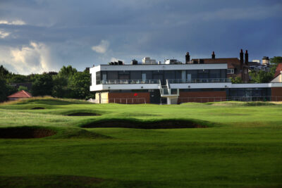 Fairway with building in background at West Lancashire Golf Club