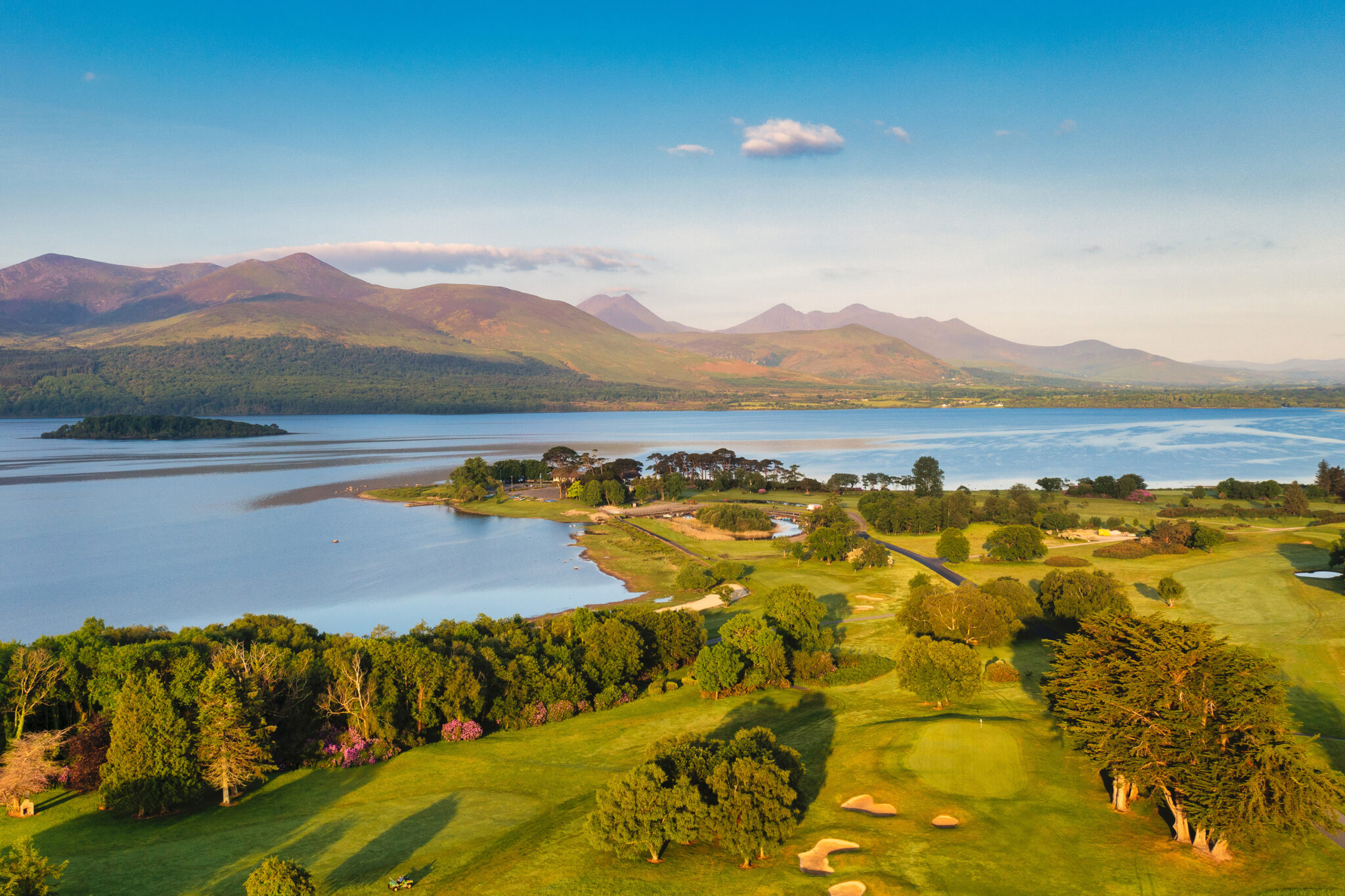 Aerial view of Killarney Golf & Fishing Club - Killeen Course with lake and hills in background