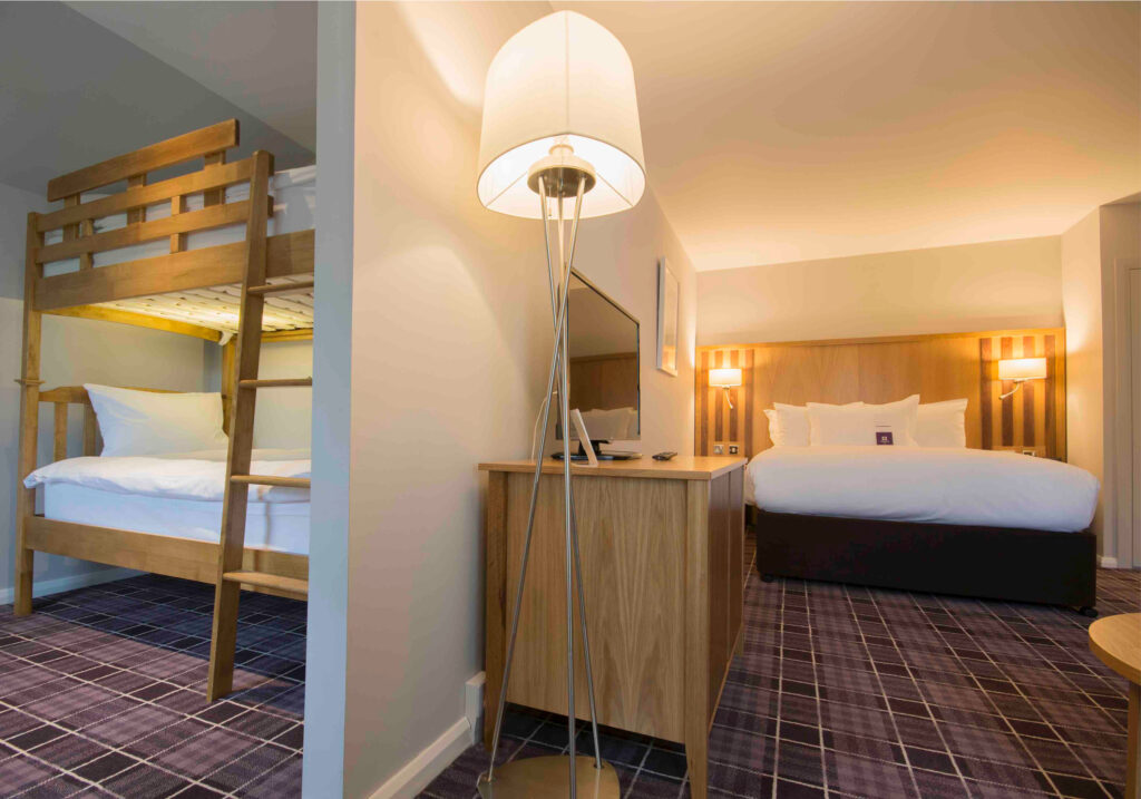 Accommodation at Kingsmills Hotel with a double bed and a bunk bed