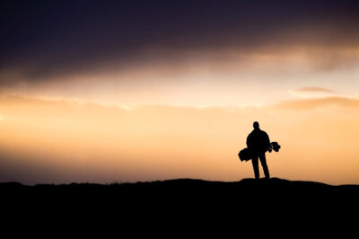 Person playing golf at sunset at Lahinch Coast Hotel