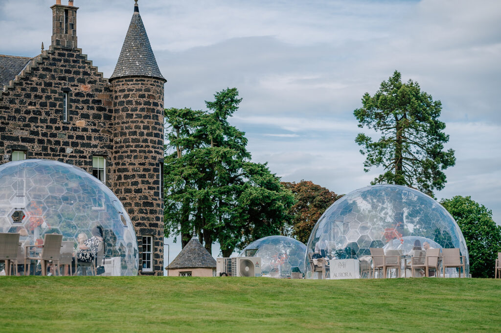 Outdoor dining domes at Meldrum House Country Hotel & Golf Course