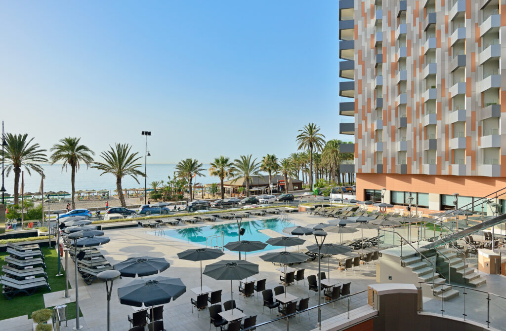 Outdoor pool with loungers at Melia Costa Del Sol