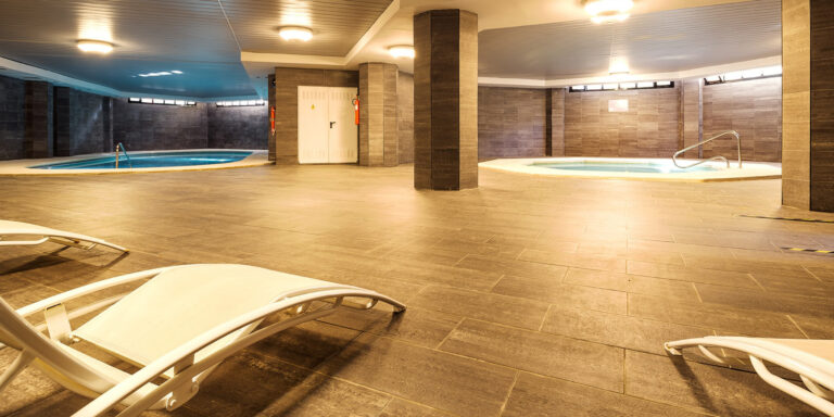 Indoor pool and hot tub at Mimosas Suites Banus Hotel