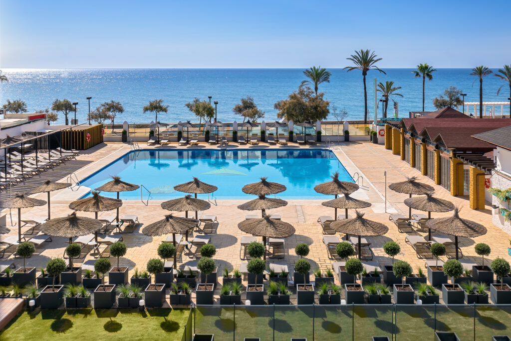 Outdoor pool with sun loungers at Occidental Fuengirola