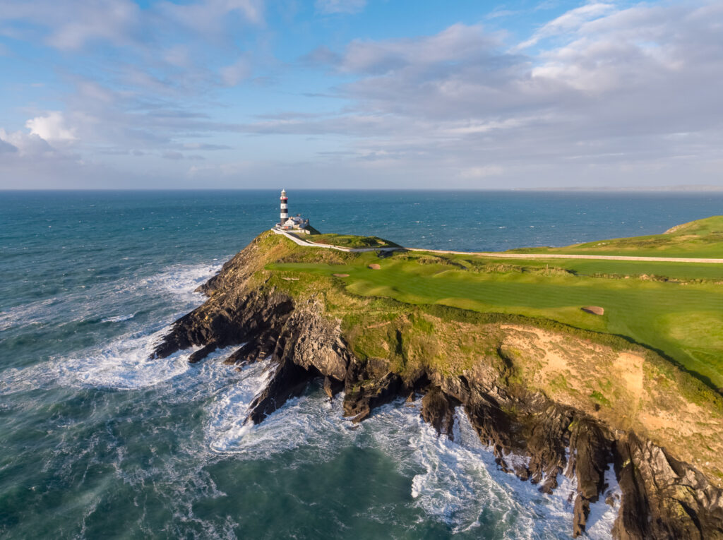 Fairway with bunkers at The Suites at Old Head Golf Links with lighthouse