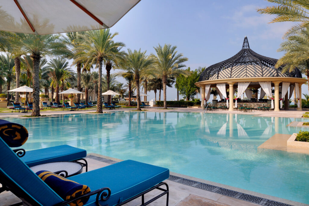 Outdoor pool with loungers at One & Only Royal Mirage Dubai Jumeirah