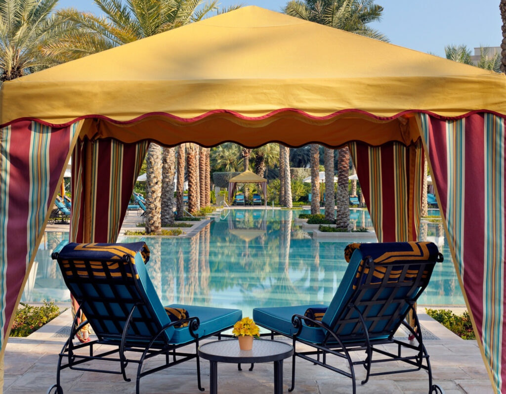 Loungers by outdoor pool at One & Only Royal Mirage Dubai Jumeirah