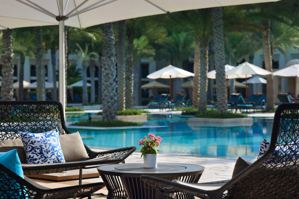 Outdoor seating at One & Only Royal Mirage Dubai Jumeirah by outdoor pool