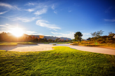 Bunkers on fairway at Pearl Valley Golf Course with trees in distance