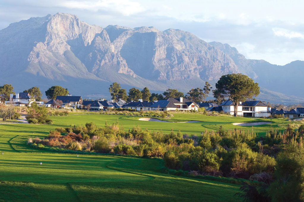 Fairway at Pearl Valley Golf Course with buildings and mountains in distance