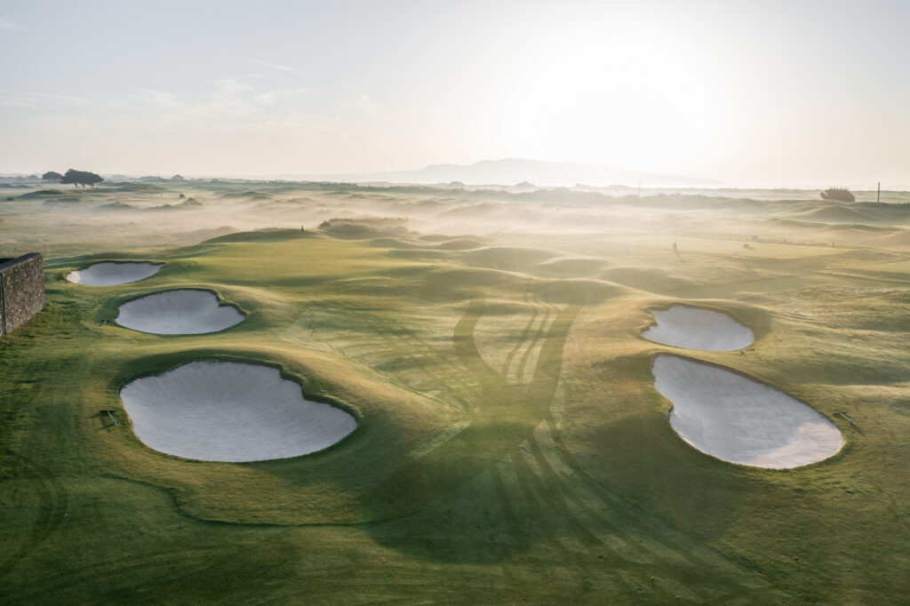 Hole with bunkers around at Royal Dublin Golf Club