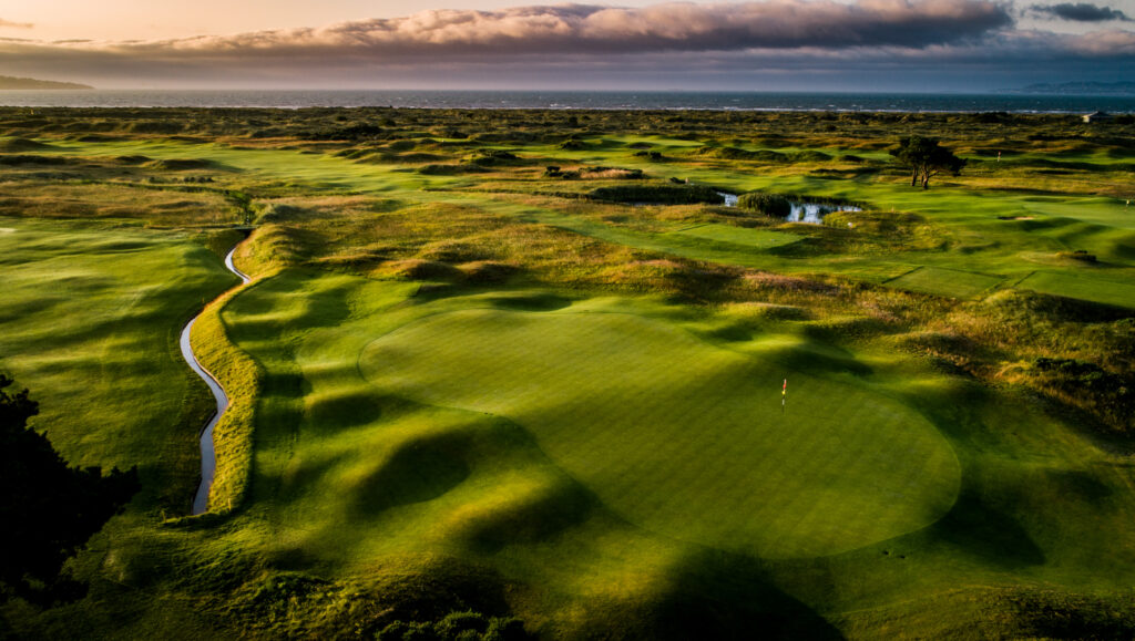 Hole with water hazard nearby at Royal Dublin Golf Club