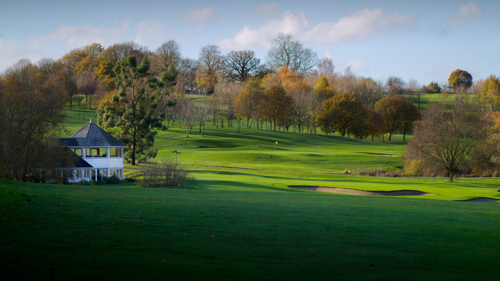 Bunkers on fairway at Sandford Springs with building in background